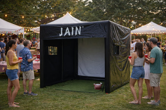 Mobile inflatable golf simulator setup at a corporate event