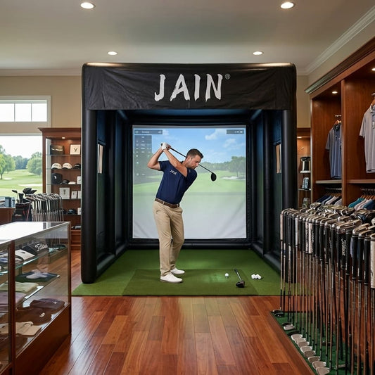 A professional JAIN inflatable golf simulator enclosure installed in a luxury pro shop for club fitting and coaching.