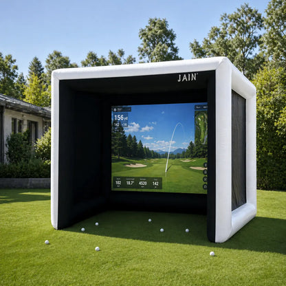 funjain inflatable golf simulator tent set up on a backyard lawn with realistic golf simulator screen and scattered golf balls