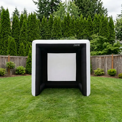 Front view of a Funjain portable inflatable golf simulator cage on a green lawn for outdoor golf practice.
